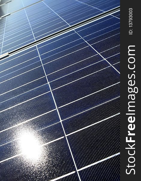 Modern solar photo voltaic panel close up with great blue cells details in a perspective view. Great for energy and environment themes.