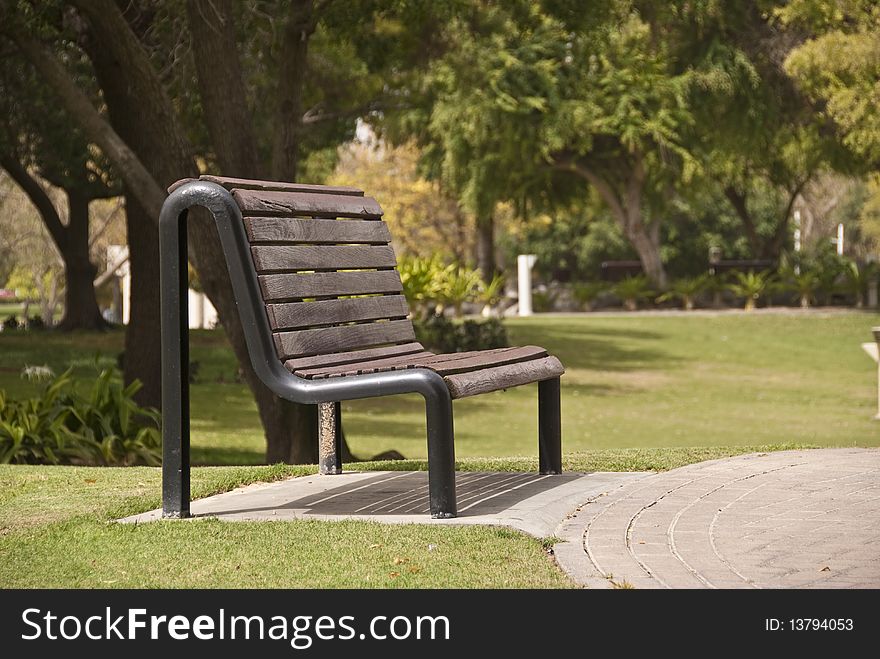 A bench at a park. A bench at a park