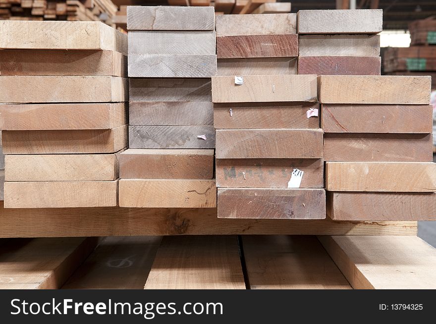 Packed warehouse with wood ready for construction. Packed warehouse with wood ready for construction