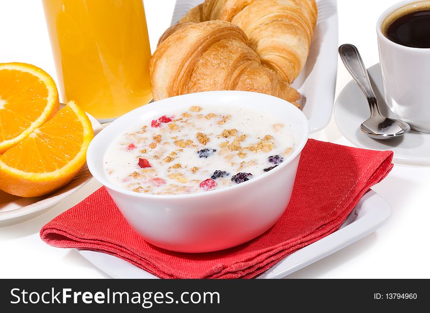 Breakfast with  muesli,  croissants, coffee, orange juice,