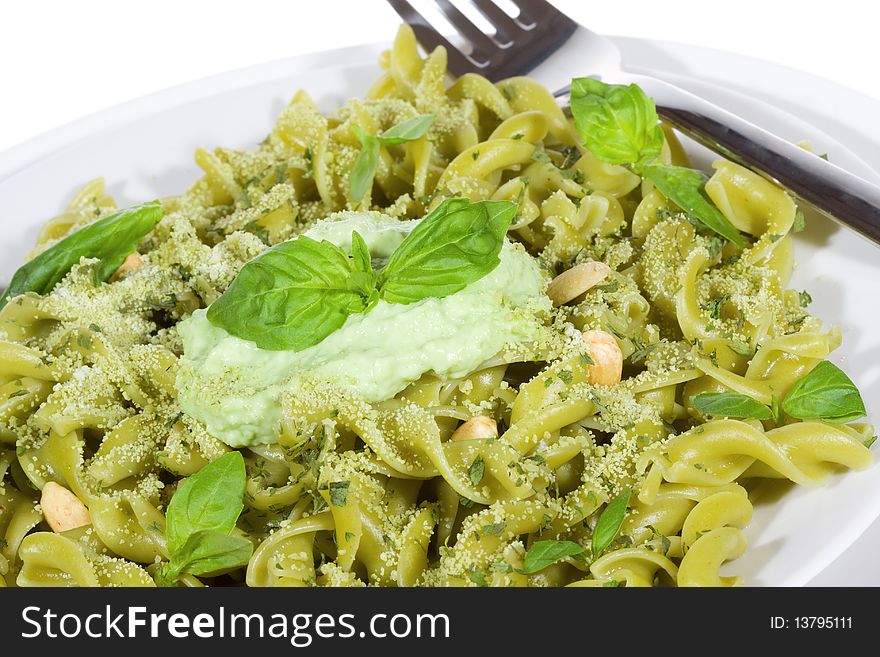 Pasta with pesto cream sauce and basil. Pasta with pesto cream sauce and basil