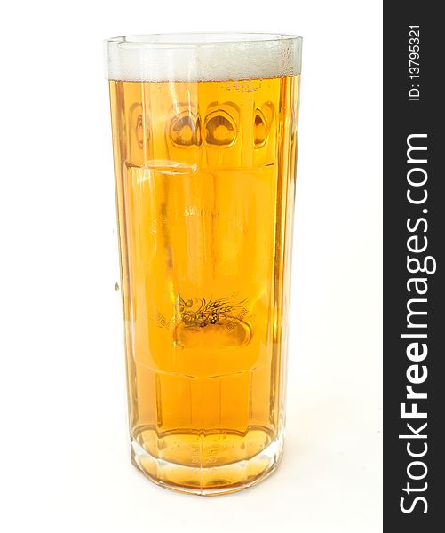 Image of a large glass of fresh beer with  white foam