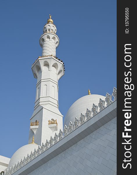 A view of the marble clad minaret and the done with gold cresents. A view of the marble clad minaret and the done with gold cresents