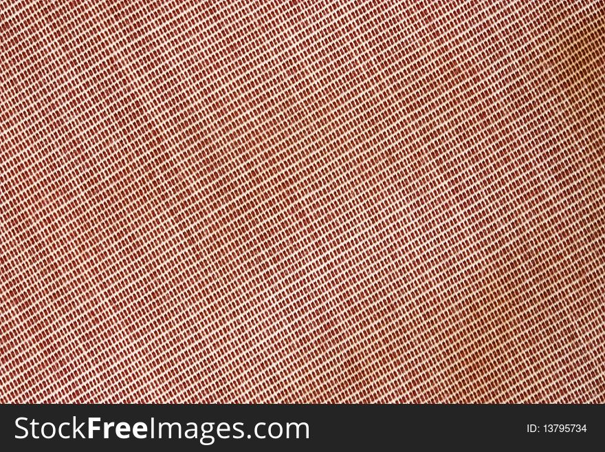 A background of pink textured fabric. A background of pink textured fabric