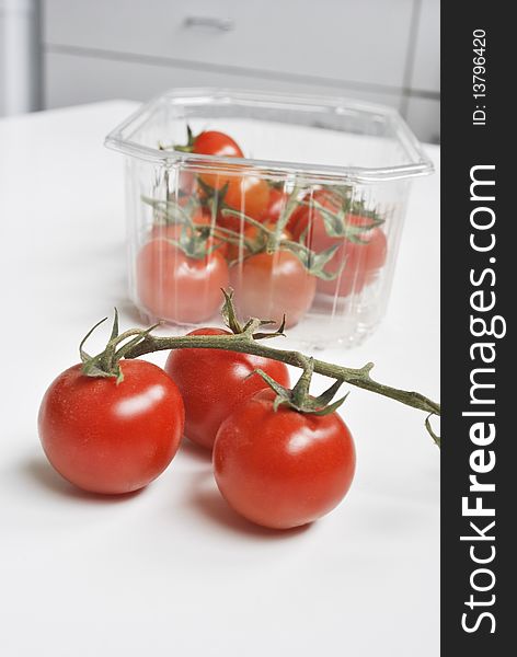 Plenty of cherry tomatoes on the table and in the package
