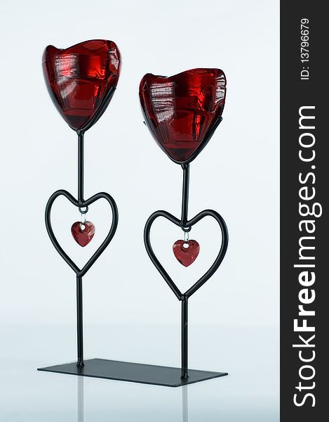 Heart shape candlestick on bright background.