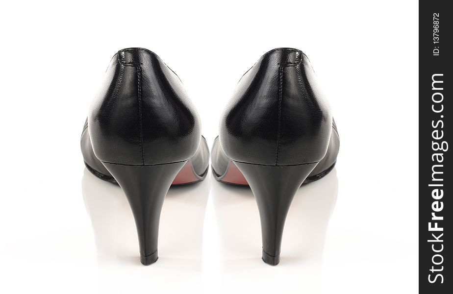 Womens black shoes with a heel on a white background