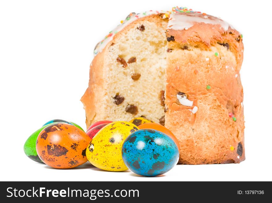 Easter cake and colored eggs on a white background