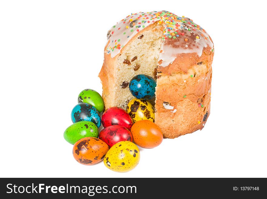 Easter cake and colored eggs on a white background