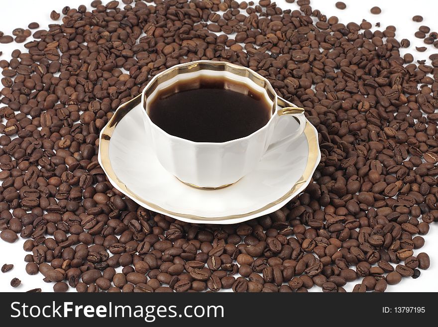Cup of delicious coffee on a white background