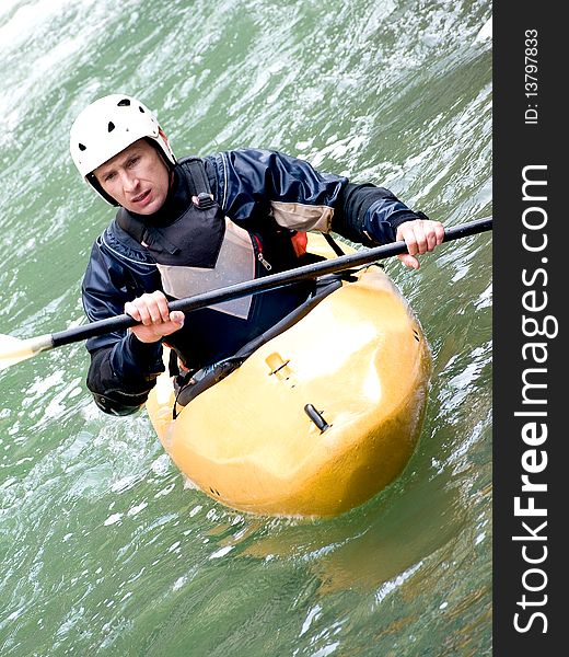 A shot of the kayaker with an oar on the water