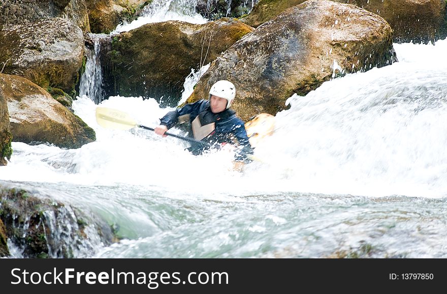 A shot of the kayaker with an oar on the water