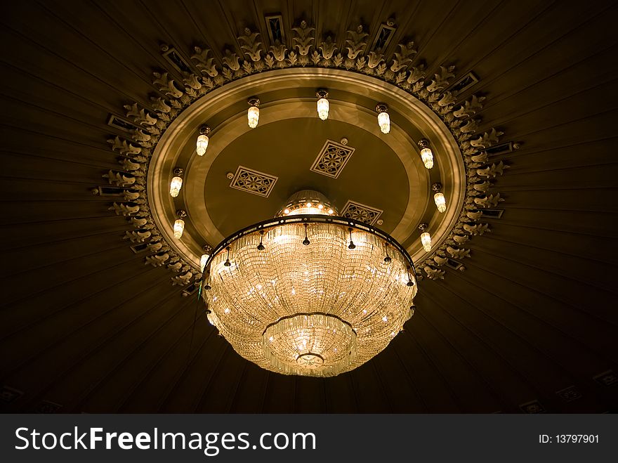 Chandelier on the ceiling of the theater. Chandelier on the ceiling of the theater