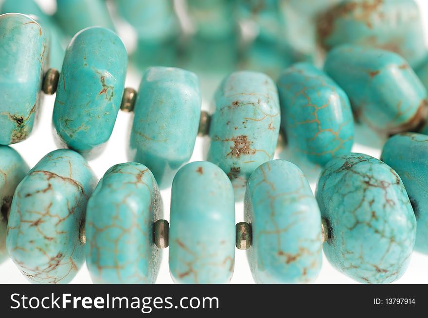 Beads with natural stone turquoise close-up. Beads with natural stone turquoise close-up