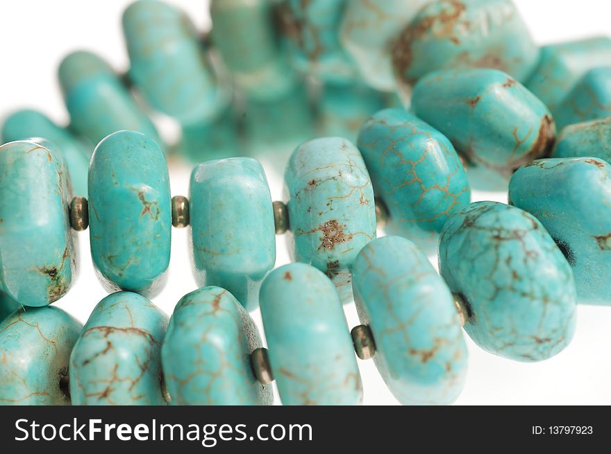 Beads with natural stone turquoise close-up. Beads with natural stone turquoise close-up