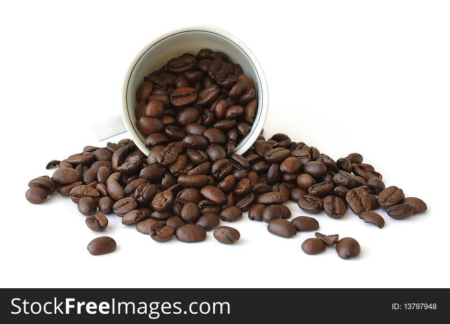 Cup with coffee beans on white background