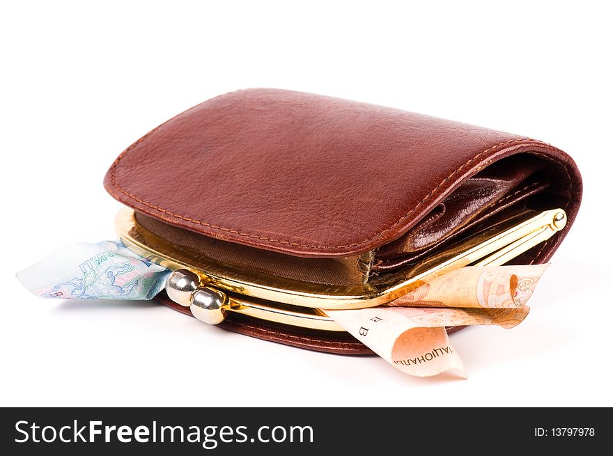 Old purse and coins against white background