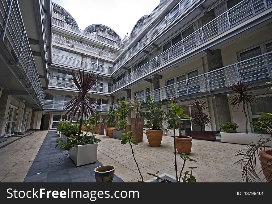 Modern multi level building with atrium and plants