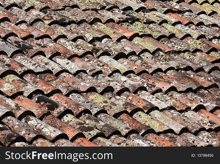 Beautiful old red tile with moss