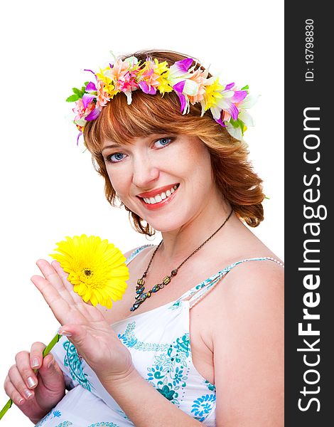 Beutiful woman with flower and wreath studio shot