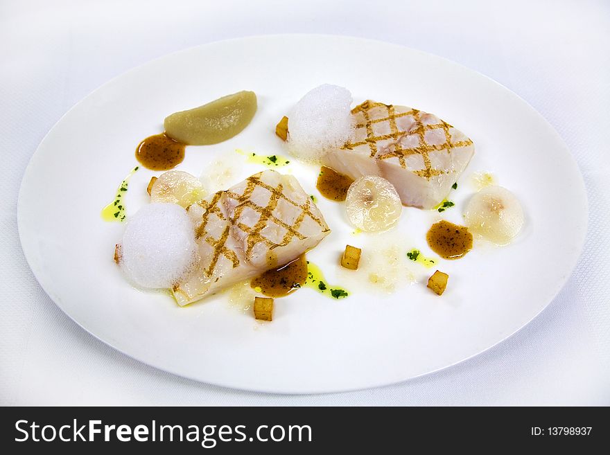 Roasted white fish on plate