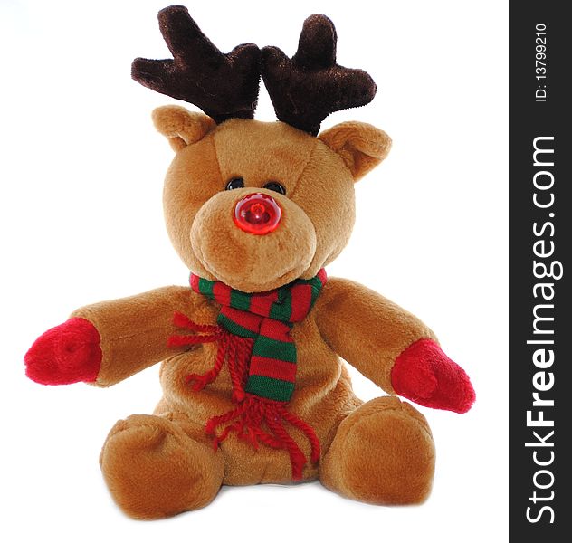 Rudolph the Reindeer in stuffed animal form with a scarf and red nose. Rudolph the Reindeer in stuffed animal form with a scarf and red nose.