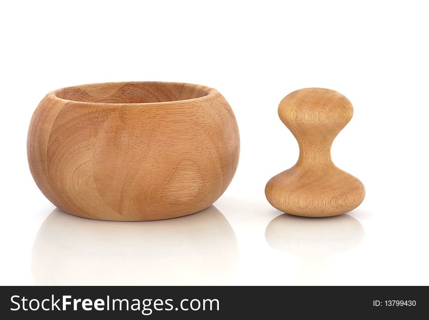 Beech wood mortar with pestle isolated over white background with reflection. Beech wood mortar with pestle isolated over white background with reflection.