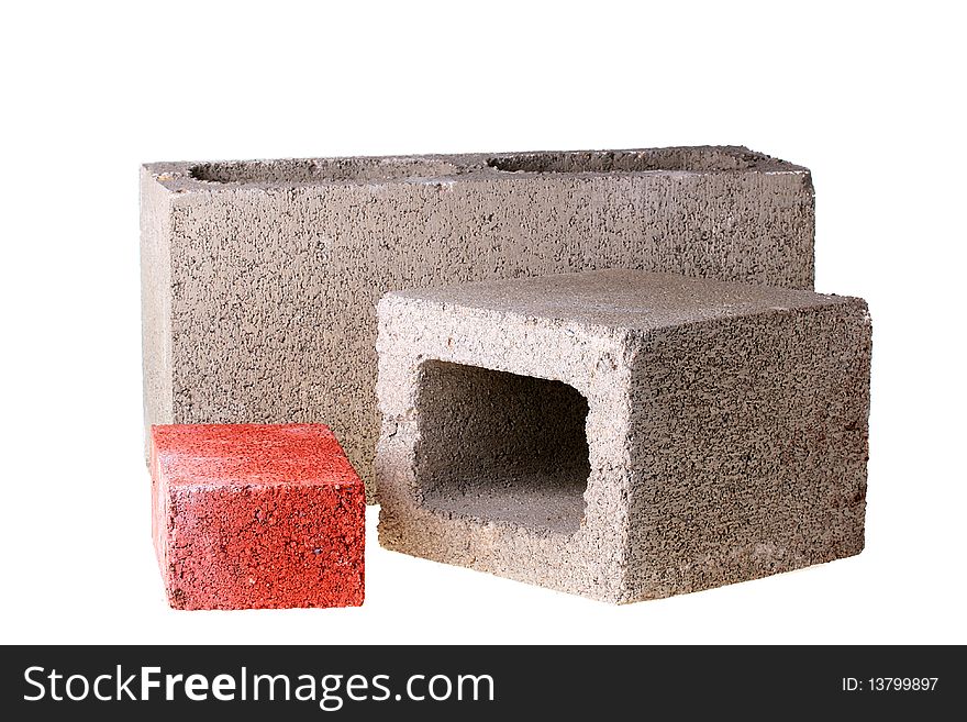 Bricks for the building, one of red clay and two of concrete.