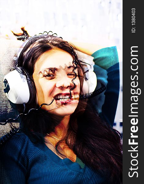 Beautiful young woman listening to music and biting headphone coil. Beautiful young woman listening to music and biting headphone coil