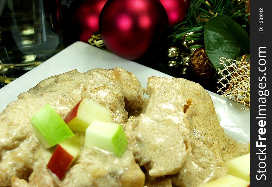 Chicken breast whit apple and christmas decoration and a bottle of wine. Chicken breast whit apple and christmas decoration and a bottle of wine
