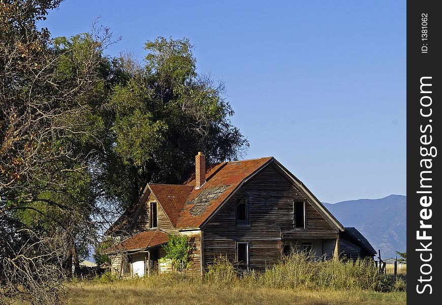 This image of the old abandoned house in disrepair was taken in western MT. This image of the old abandoned house in disrepair was taken in western MT.