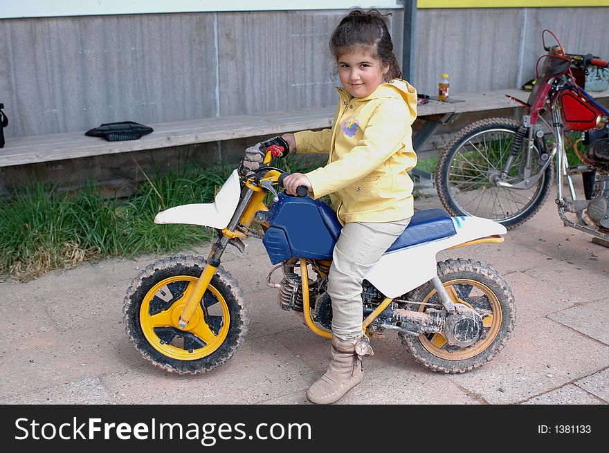 A little girl on a motorcycle. A little girl on a motorcycle