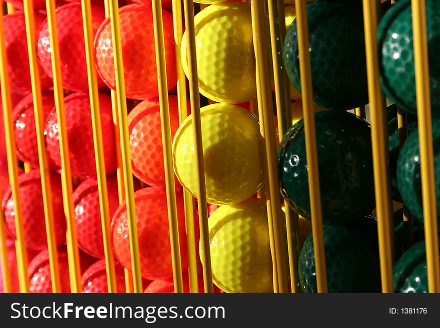 Miniature Golf Balls In A Rack