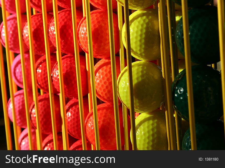 Miniature Golf Balls In A Rack