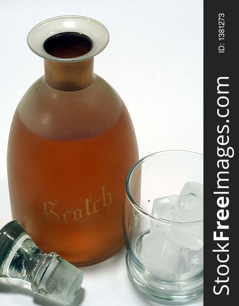 This is an image of a scotch decanter with a tumbler full of ice. This is an image of a scotch decanter with a tumbler full of ice.