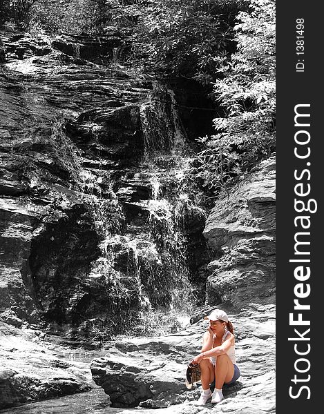 Woman By Black And White Waterfall