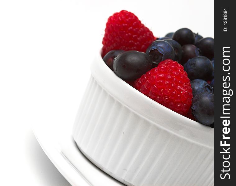 Raspberries and blueberries in a bowl. Raspberries and blueberries in a bowl