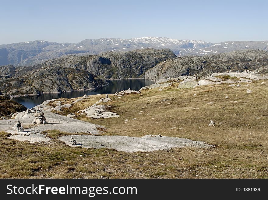 Picture of mountain lake and rocks in central Norway.