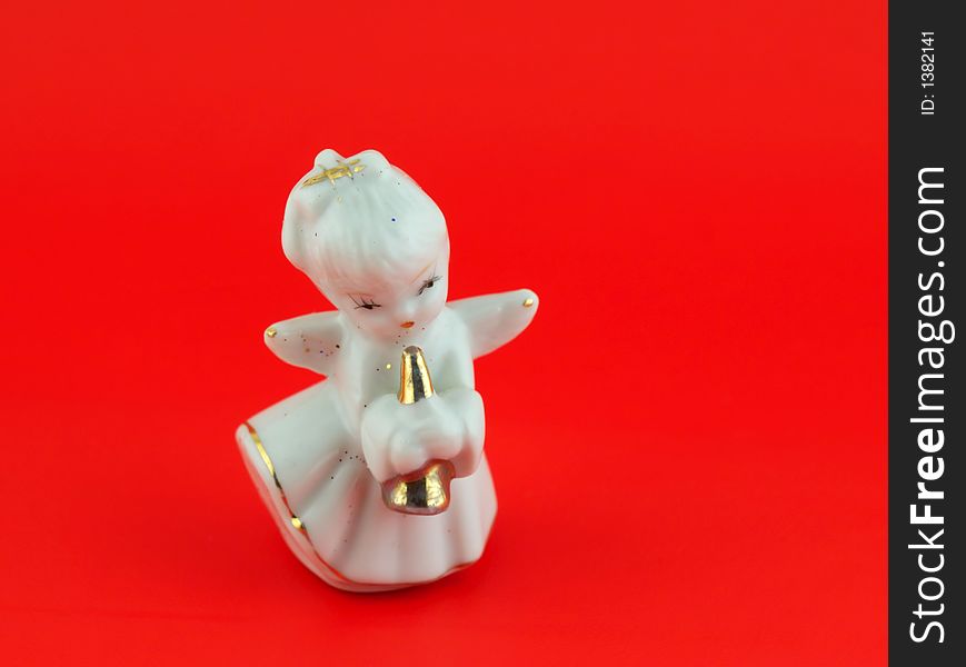 Isolated christmas decoration on red background (Angel)