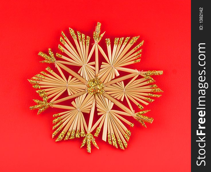 Isolated christmas decoration on red background (snow flake, octagon)