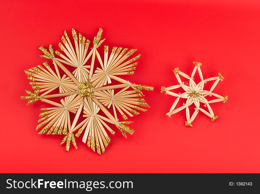 Isolated christmas decorations on red background (snow flakes, octagons)