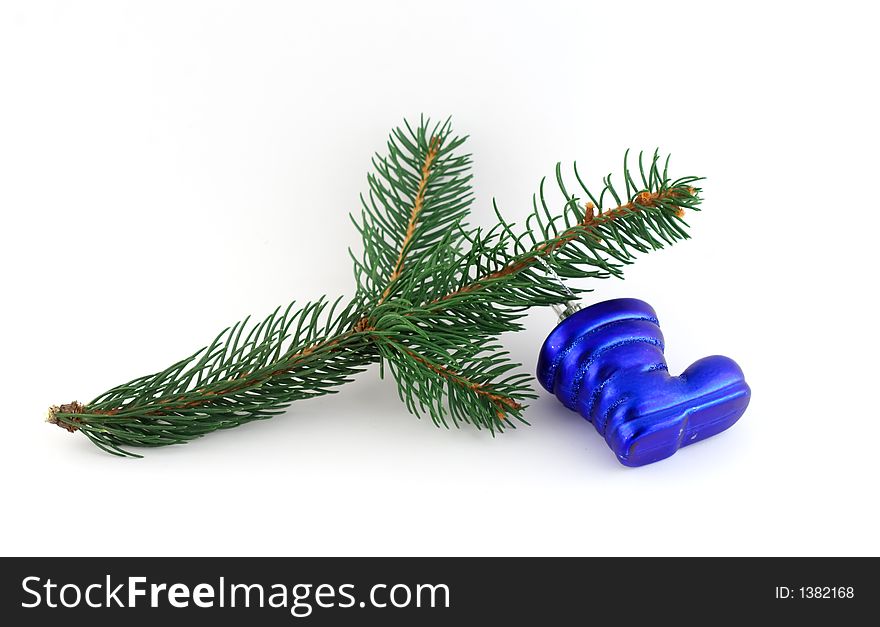 Isolated christmas decoration on white background (Twig and blue boot)