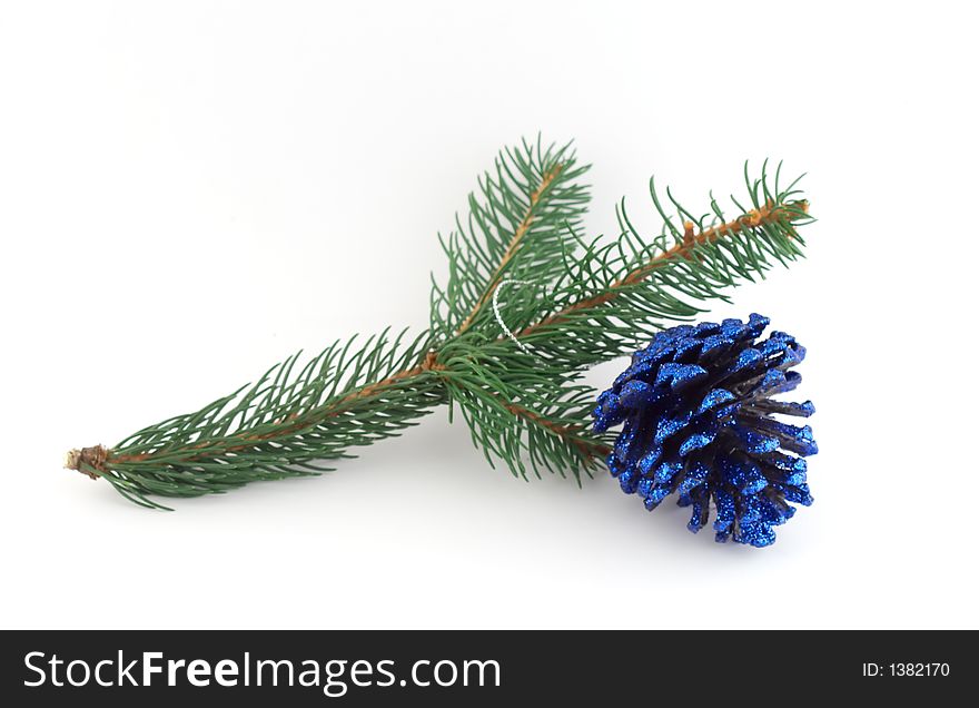 Isolated christmas decoration on white background (Twig and blue doughnut)