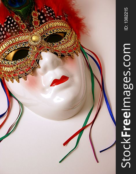 Bright, decorated porcelain mask for decorations and celebrations. Bright, decorated porcelain mask for decorations and celebrations.