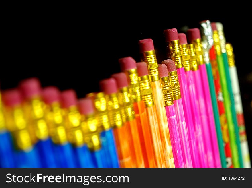 Pencils arranged on a random order. Pencils arranged on a random order.