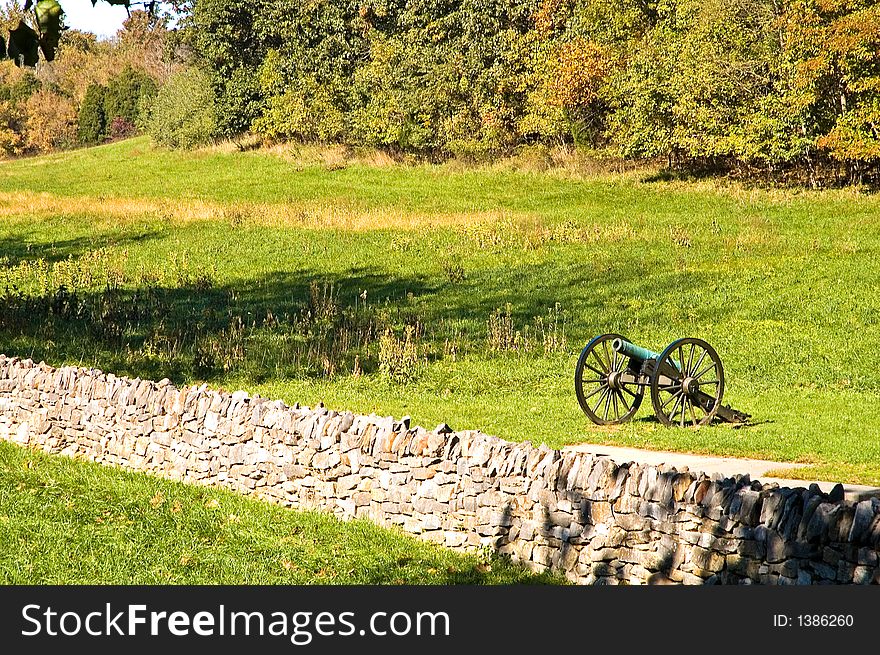 A lone Civil War cannon at Burnsides Bridge on the Antietam National Battlefield, Sharpsburg, Maryland on an autumn afternoon. A lone Civil War cannon at Burnsides Bridge on the Antietam National Battlefield, Sharpsburg, Maryland on an autumn afternoon