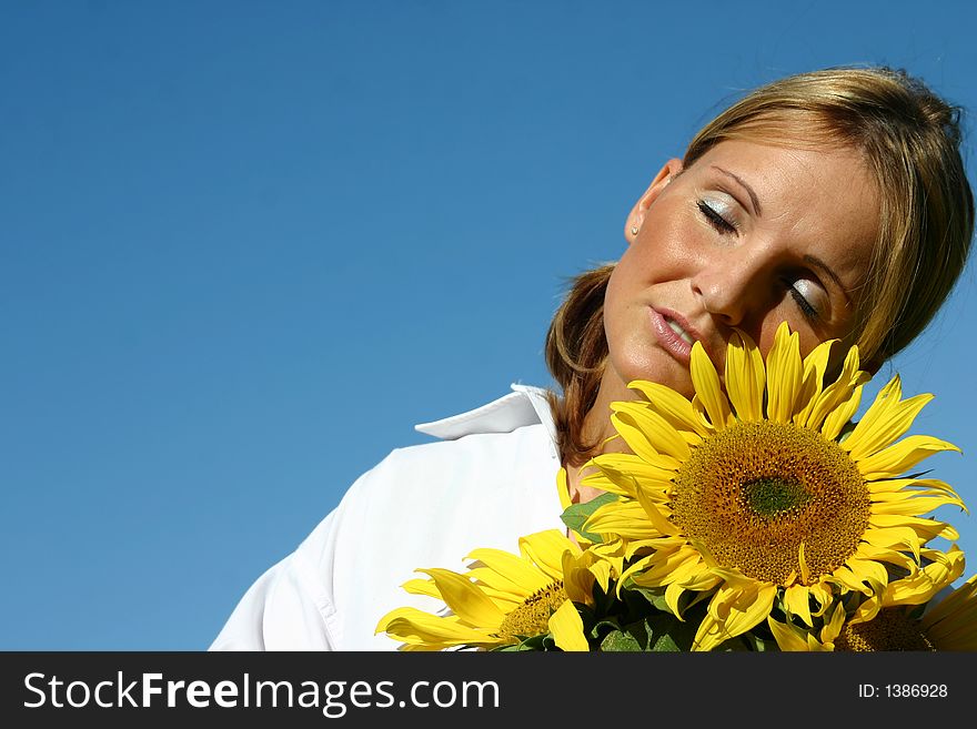 Beautiful Sunflower Woman and a blue sky.