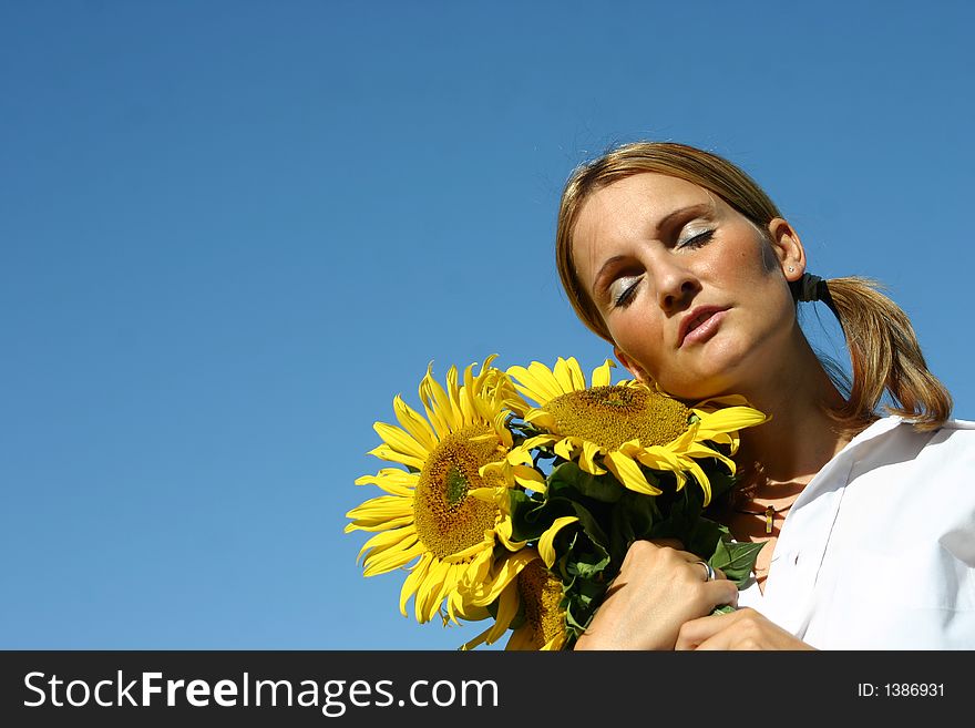 Beautiful Sunflower Woman and a blue sky.