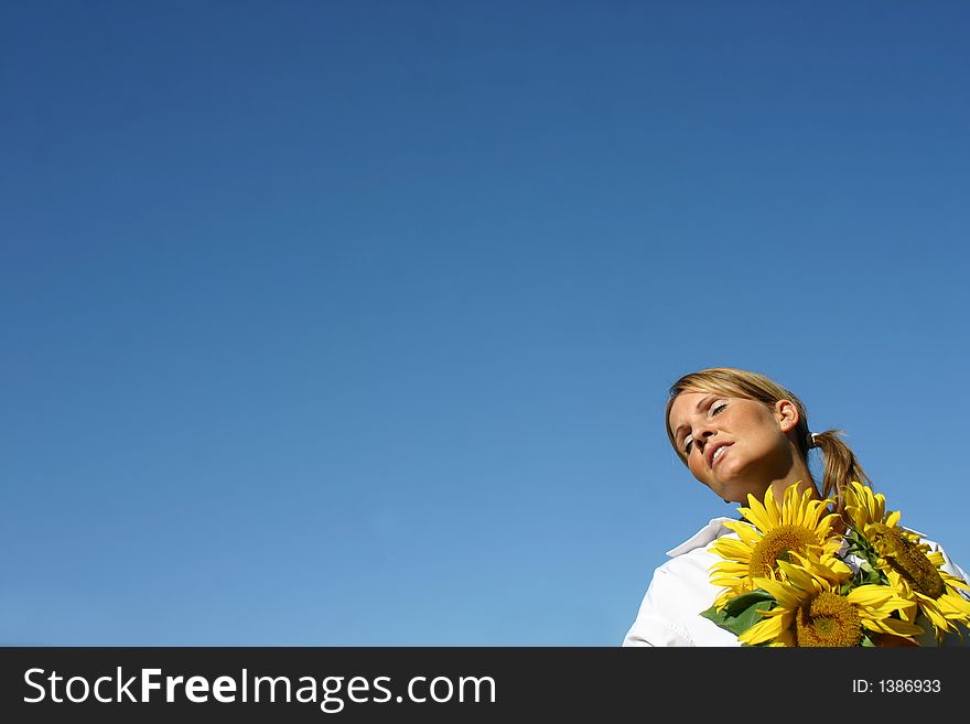 Beautiful Sunflower Woman and a blue sky.