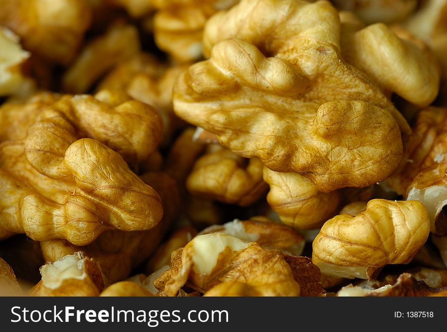 Golden shelled walnuts close up
